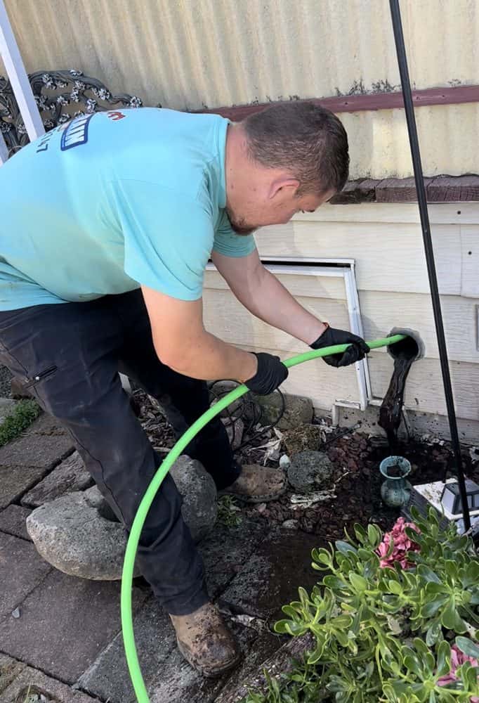 Hydro Jetting Services Skilled professional performing drain repair services in Sacramento, CA.